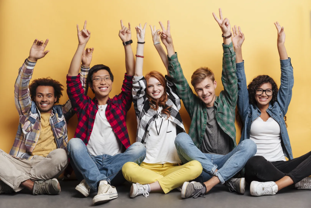 Diverse Group Of Happy Young Individuals Celebrating Success Together